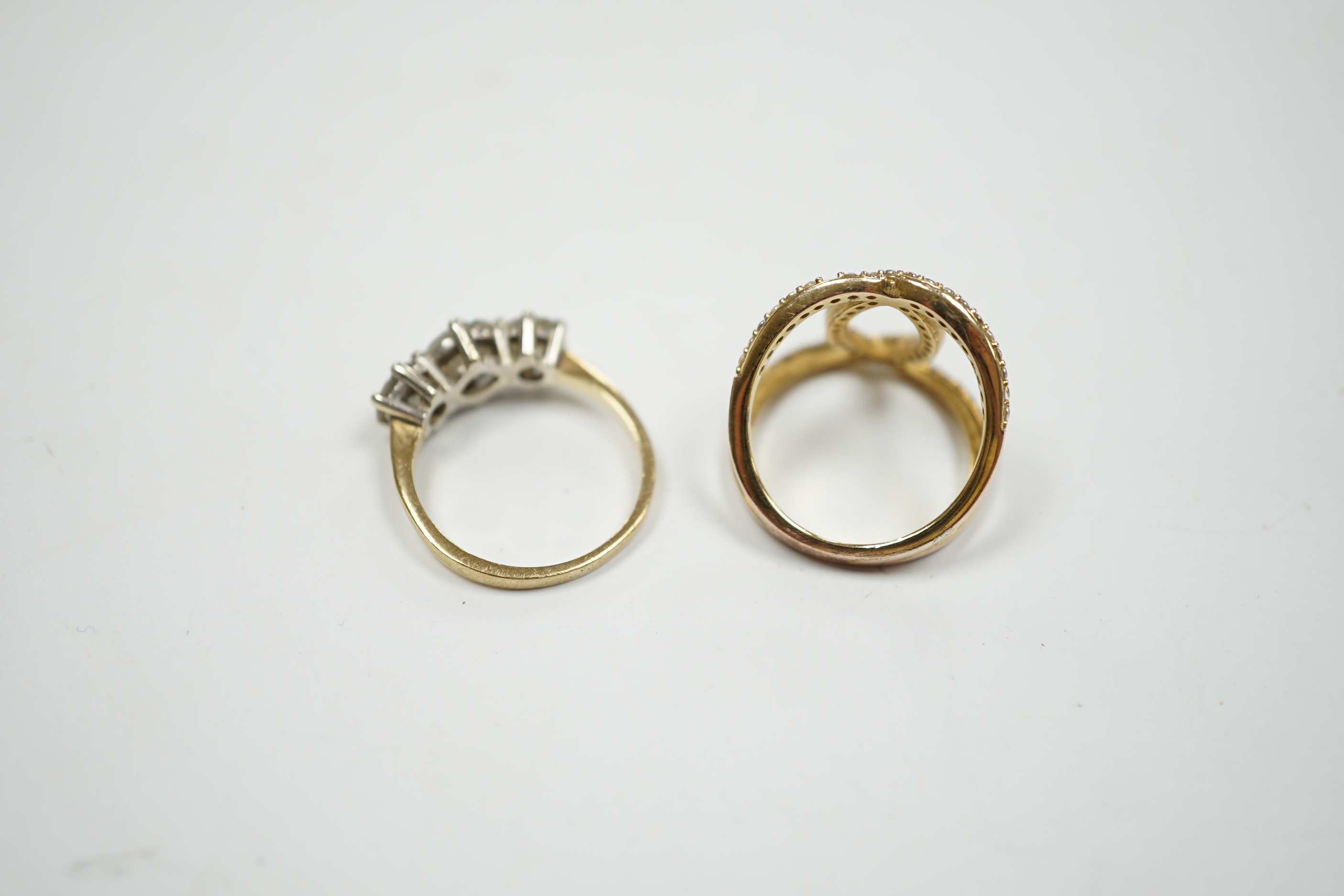 A 9ct gold and three stone simulated diamond ring and a gilt 925 ring.